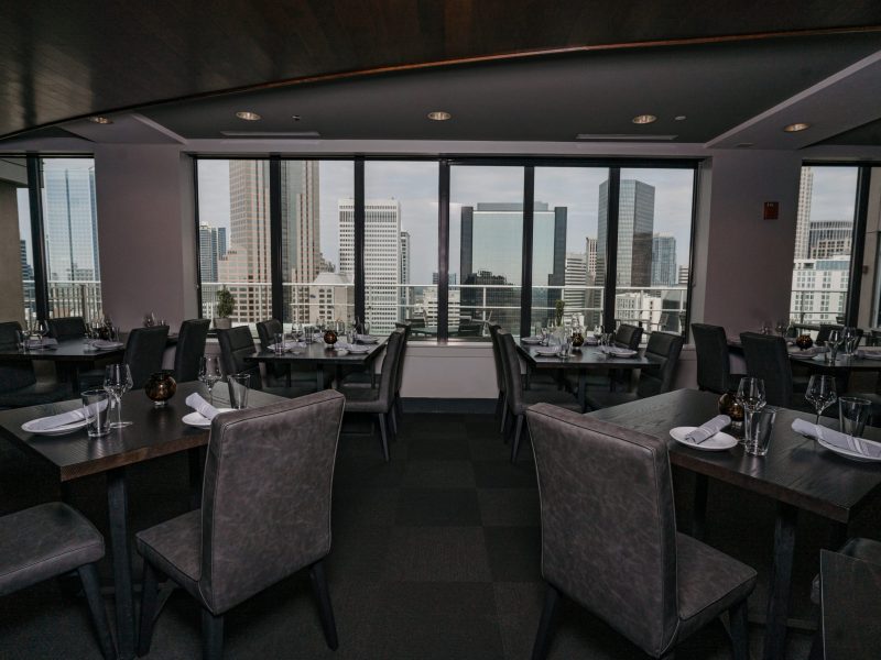 The West Dining Room features floor to ceiling windows with views of Uptown Charlotte.